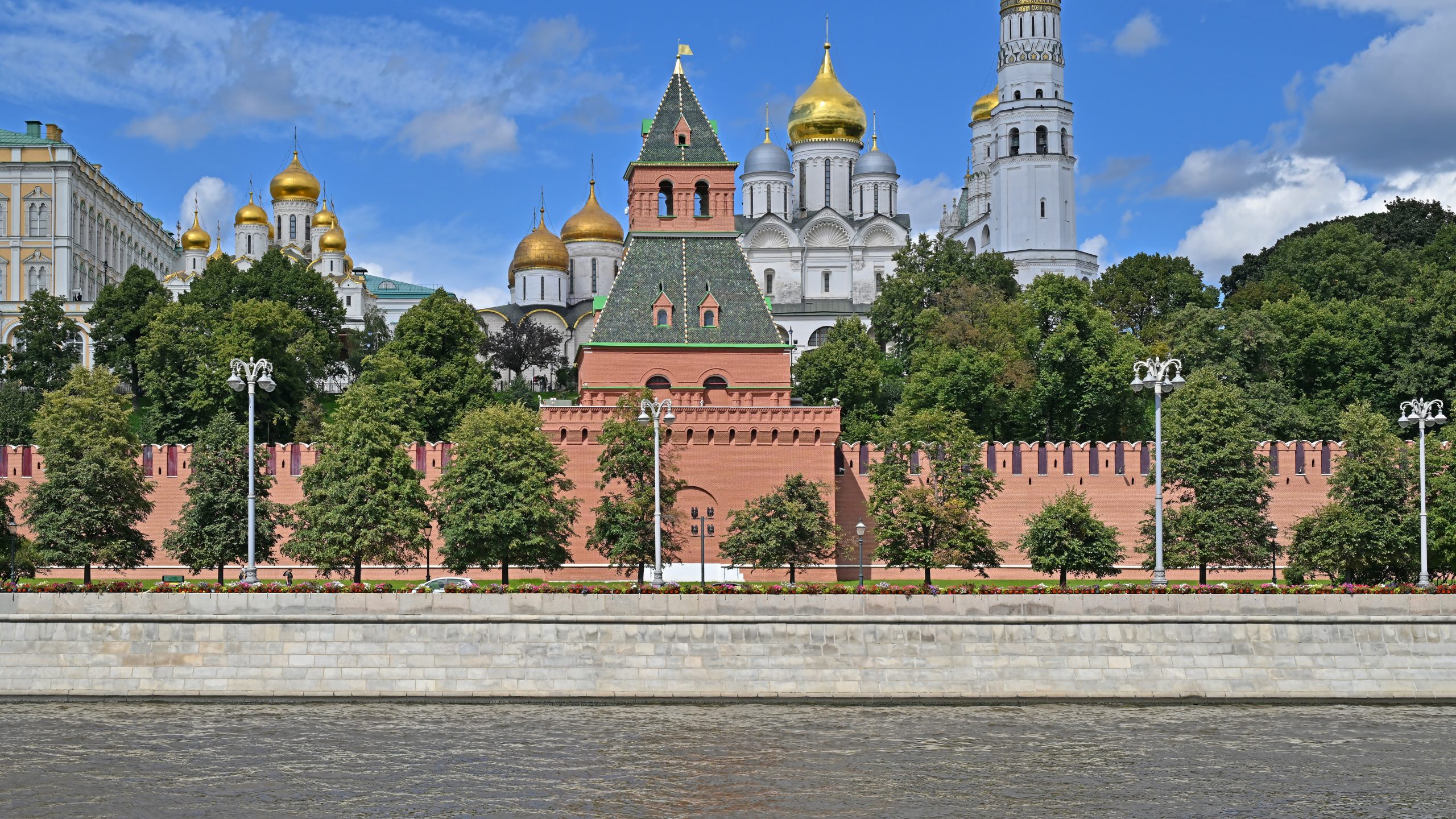 The Moscow Kremlin walls and Spasskaya Tower seen across the Moscow River.
