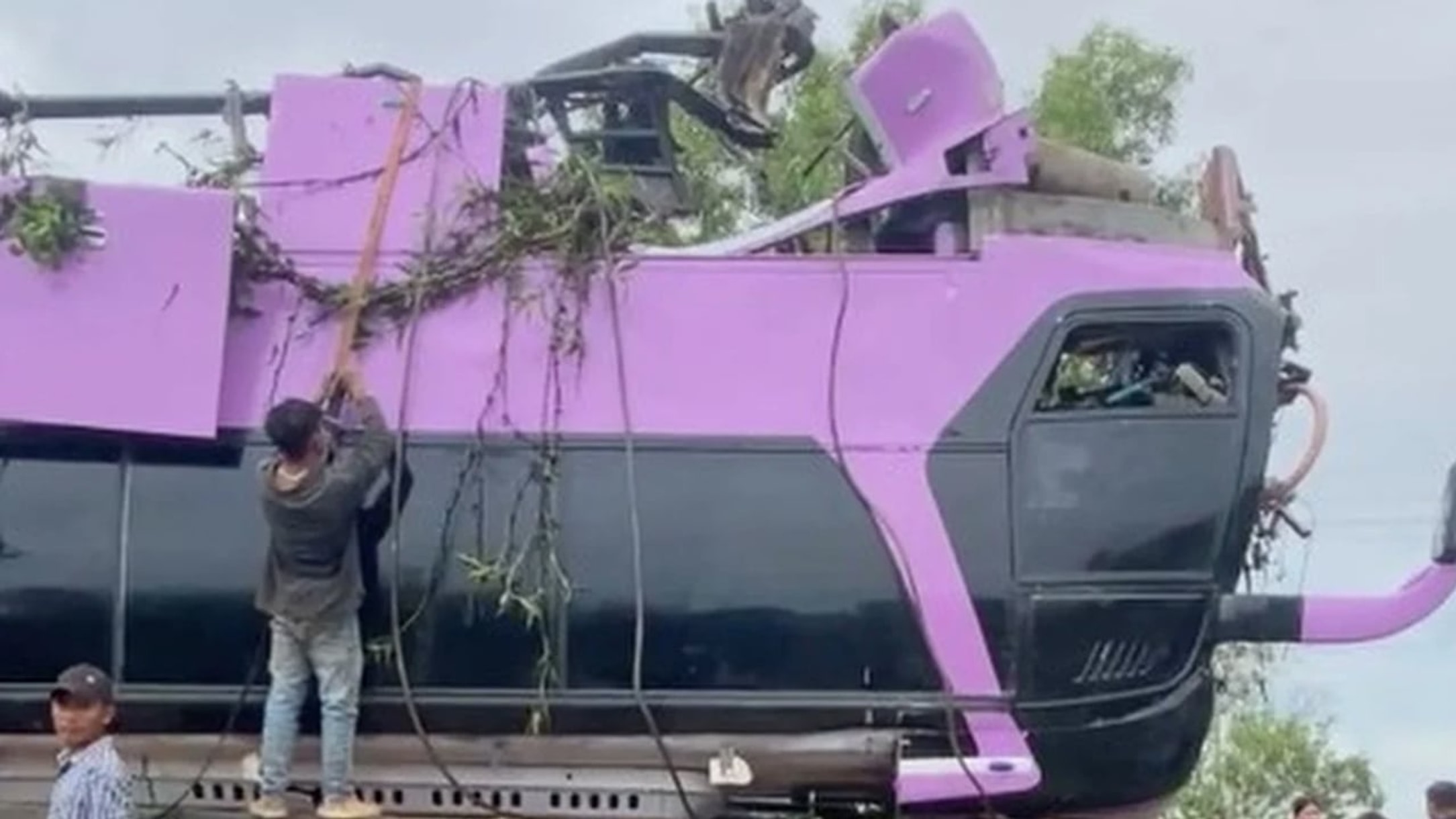 Bus plunges off bridge in Cambodia, killing 16