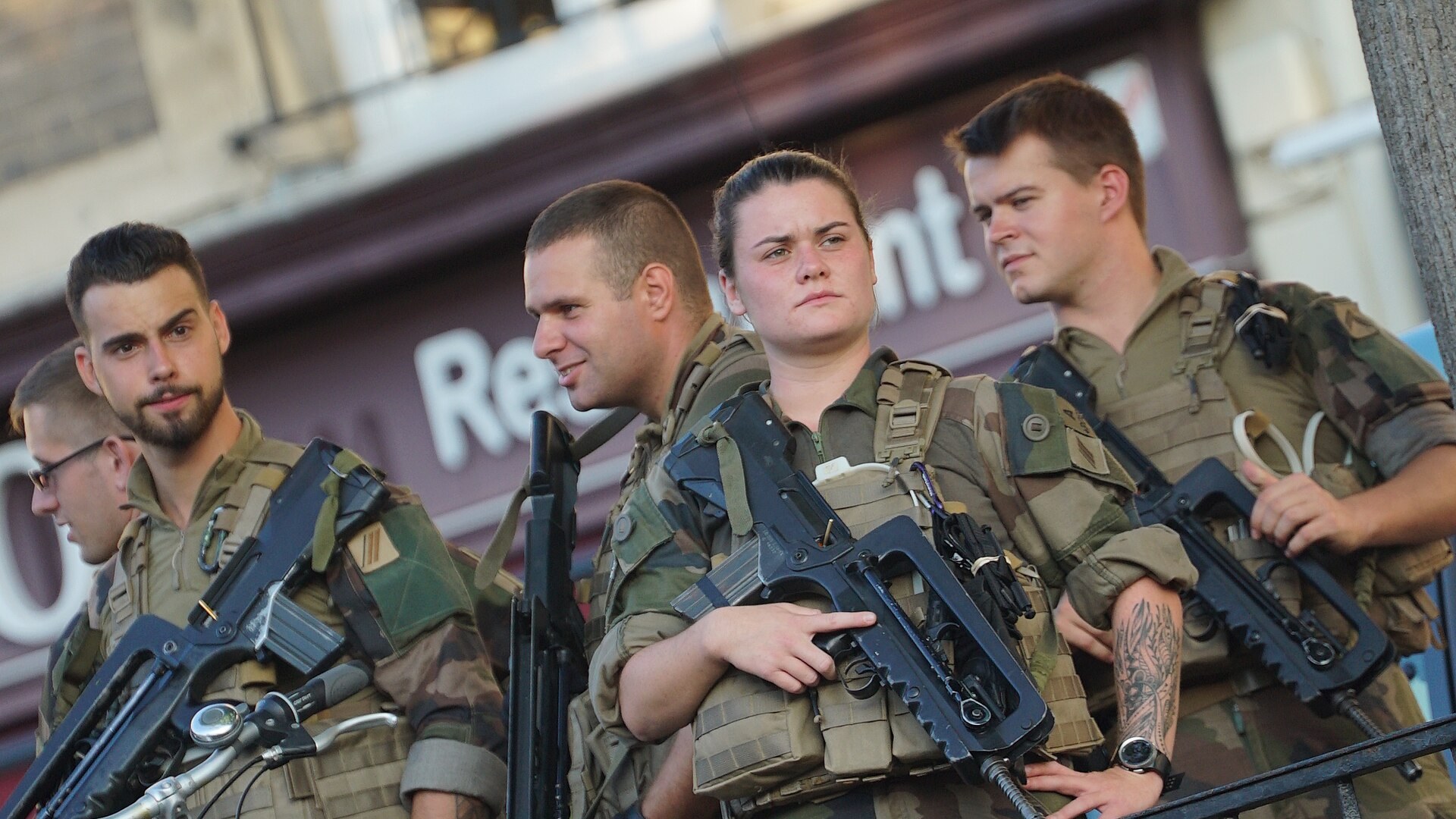 French soldiers with rifles on a street patrol in Reims
